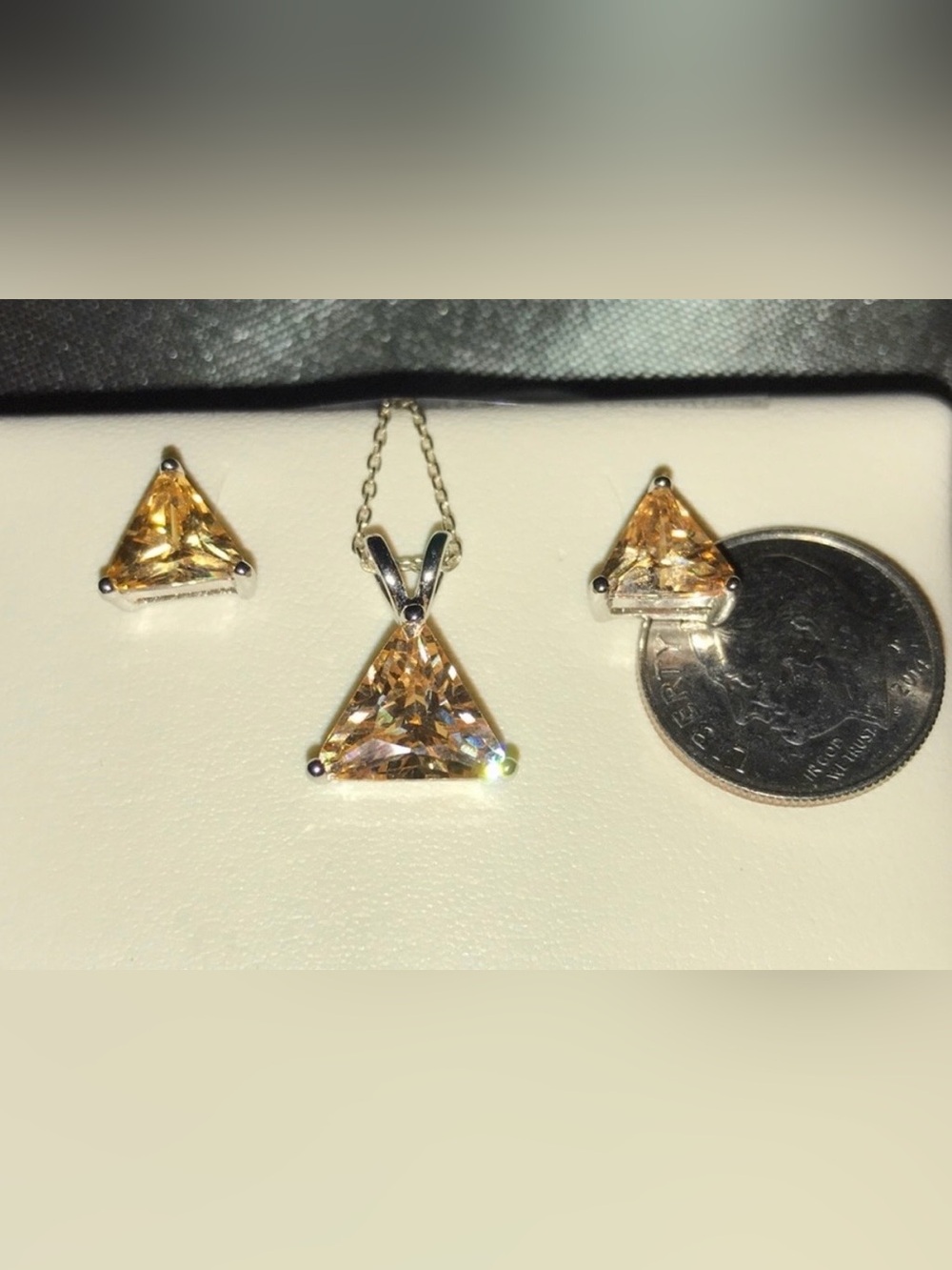 Solid sterling silver & citrine earrings and 20” necklace (including pendant).